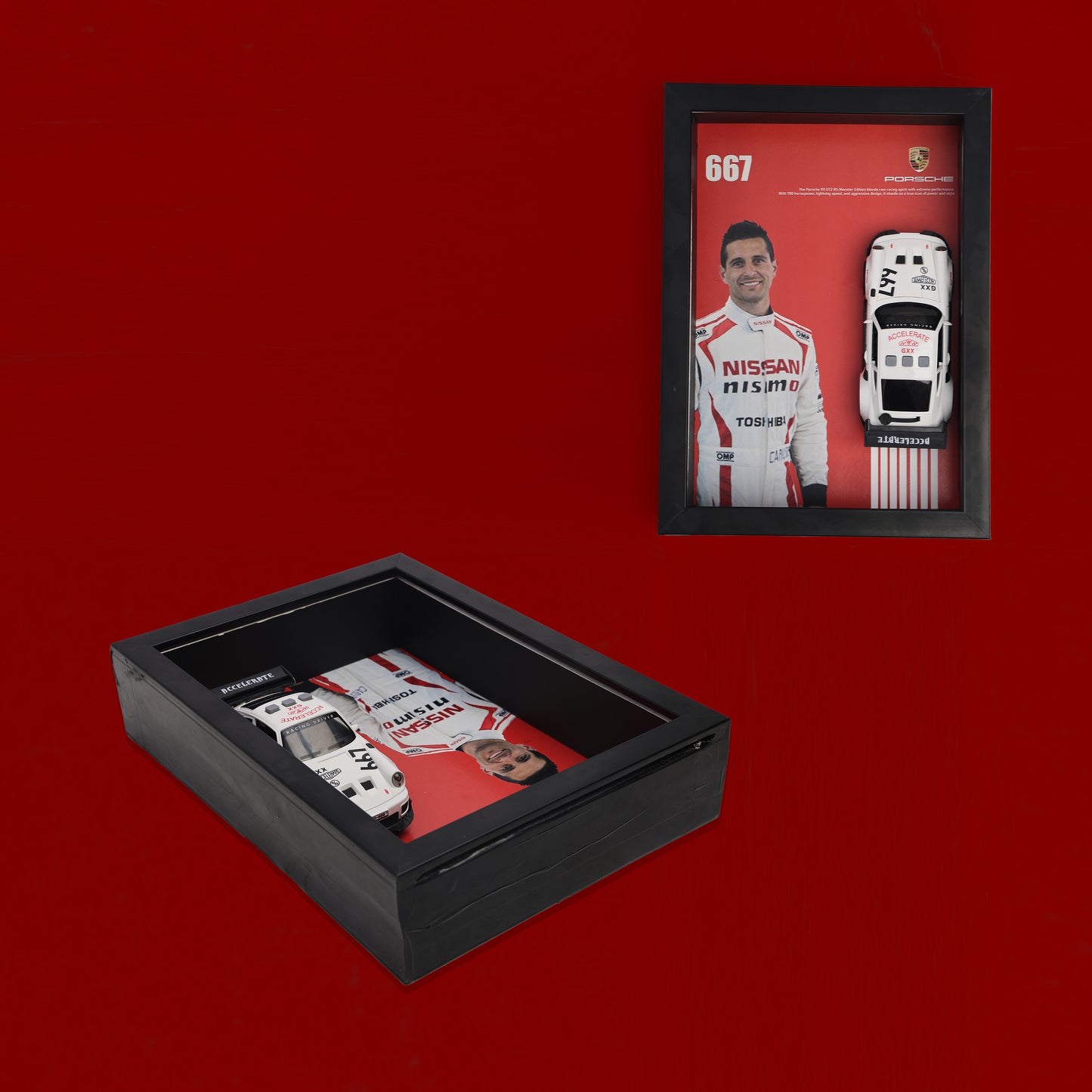 Framed picture of a race car driver and his vehicle on a red background