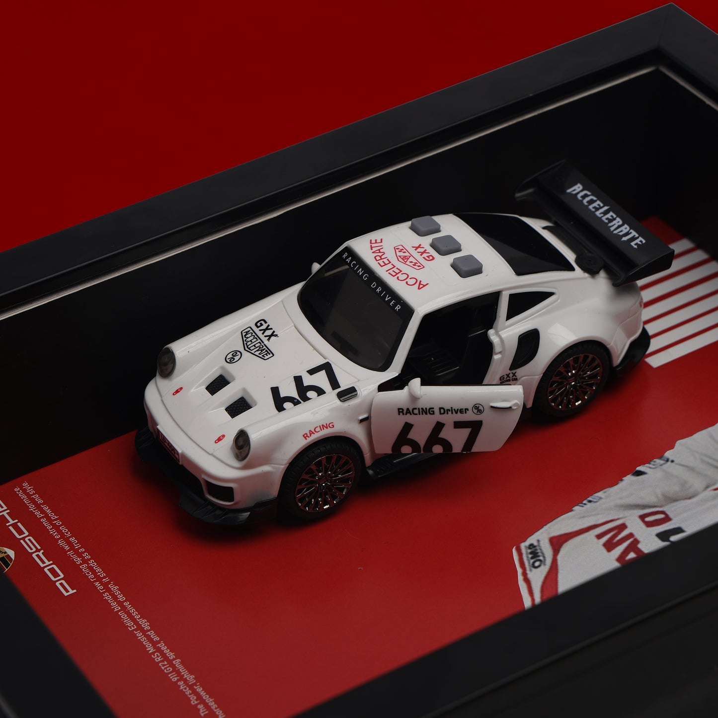 Model race car with branding on a red and black background