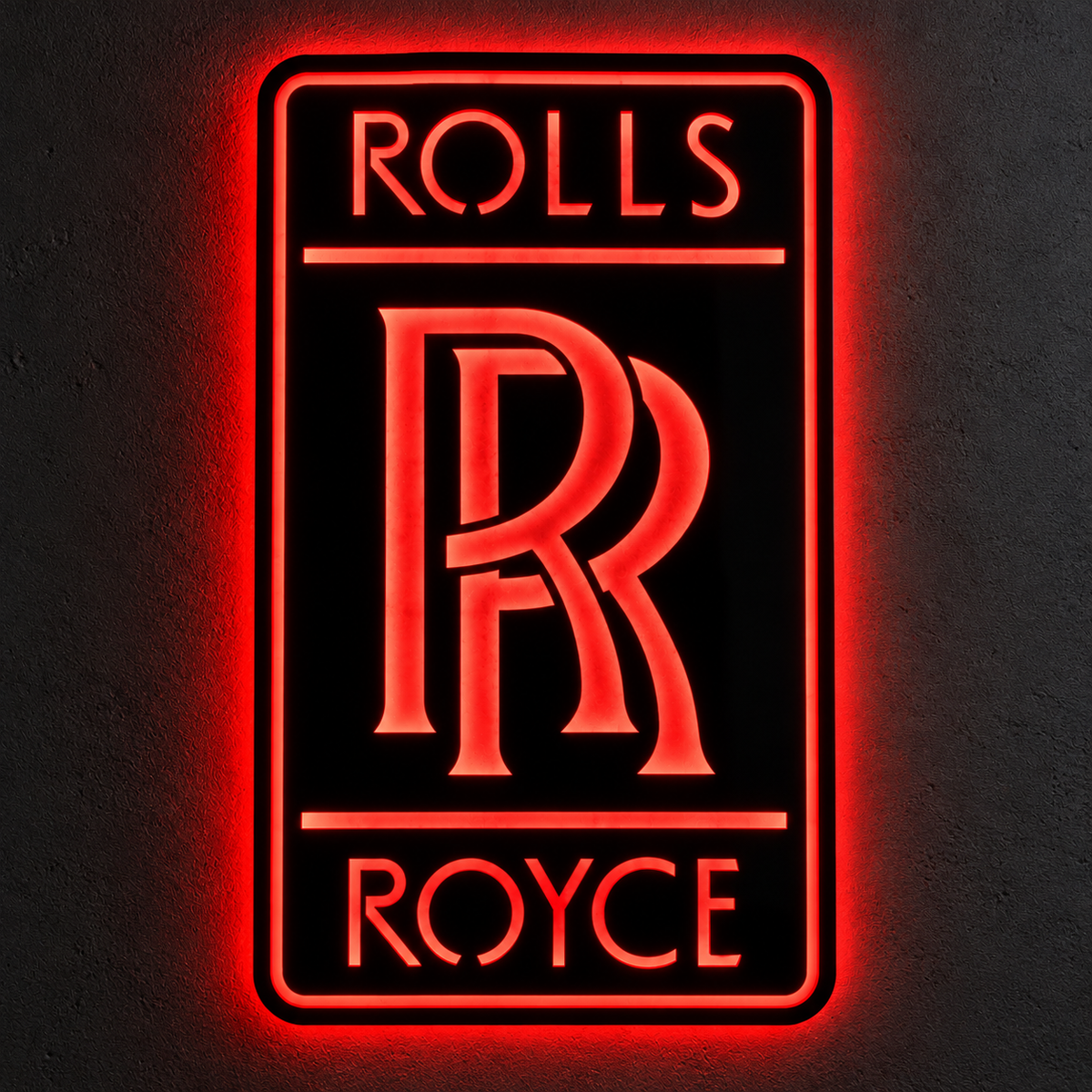Rolls-Royce logo LED wall sign with golden illumination on a black rectangular plaque against a concrete wall