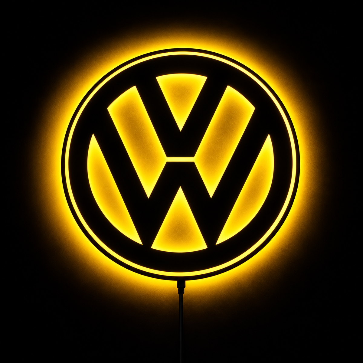 Volkswagen VW logo LED wall sign with warm yellow backlighting on a dark wall, automotive decor for garages and car enthusiasts.