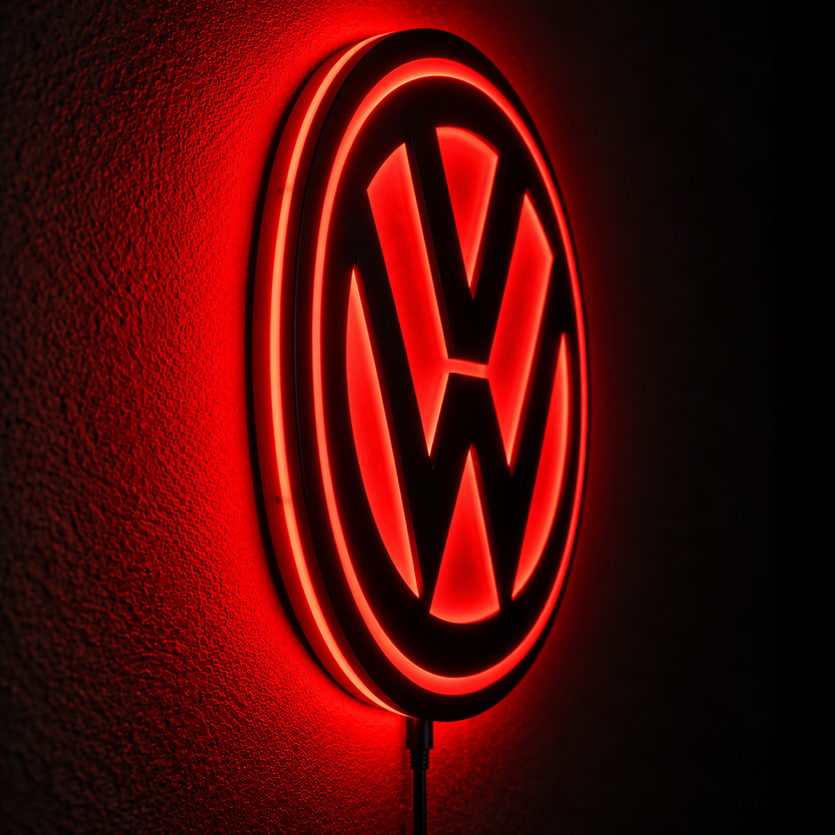Volkswagen VW logo LED wall sign with warm yellow backlighting on a dark wall, automotive decor for garages and car enthusiasts.