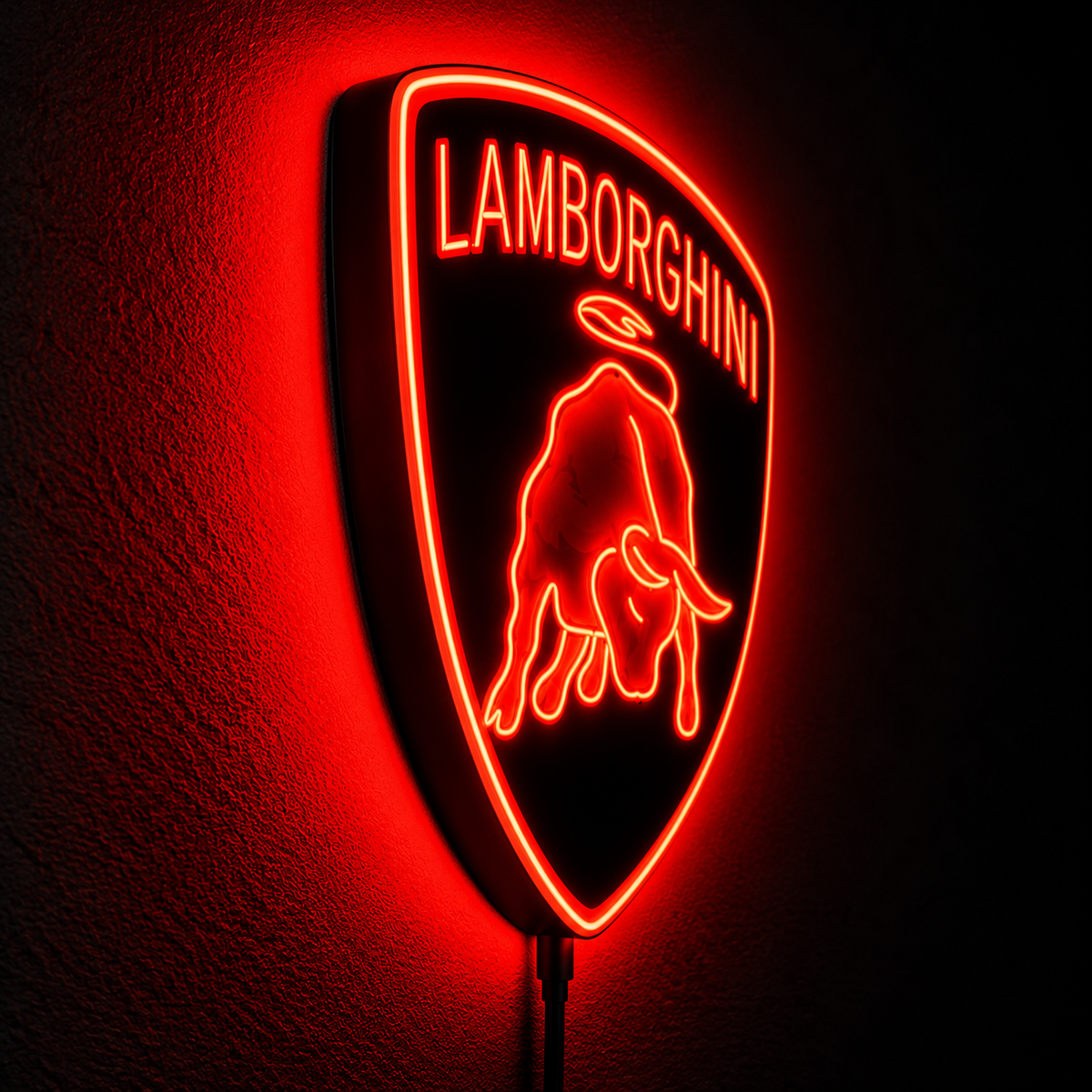 Lamborghini shield logo LED wall sign glowing yellow above a sofa in a modern living room
