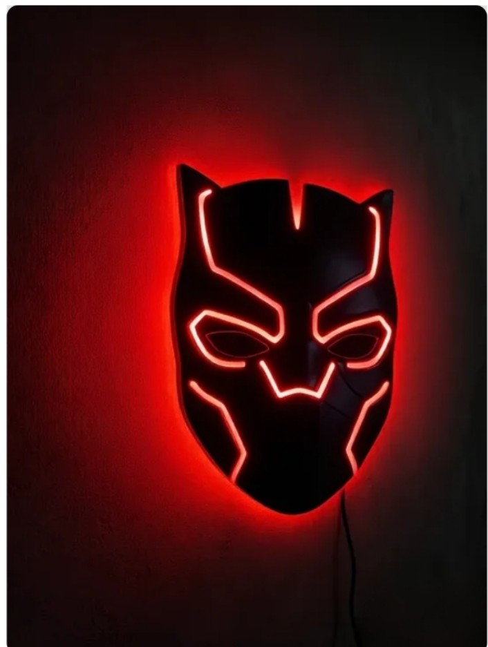 Black Panther-inspired LED wall lamp featuring a black superhero mask with glowing purple and pink backlighting on a brick wall
