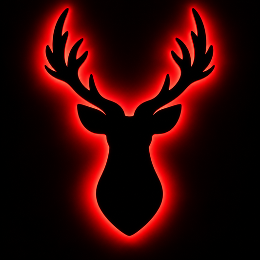 Deer head LED wall lamp with black antler silhouette and warm yellow glowing light against a blue background

