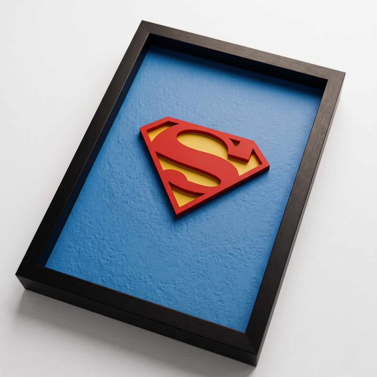 Premium Superman 3D shadow box frame with red and yellow emblem on blue background and black frame